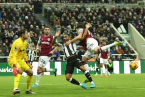 Callum Wilson of Newcastle United is tackled by Konstantinos Mavropanos of West Ham United during the Premier League match between Newcastle United FC and West Ham United FC at St James' Park on November 25, 2024 in Newcastle upon Tyne, England. (Photo by Carl Recine/Getty Images) | Getty Images